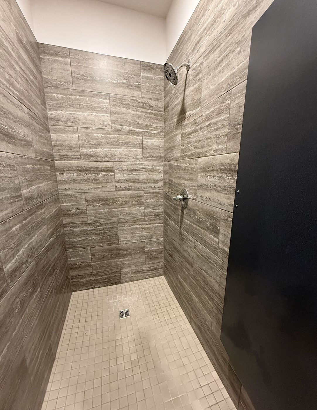 Private tiled shower in the bath house