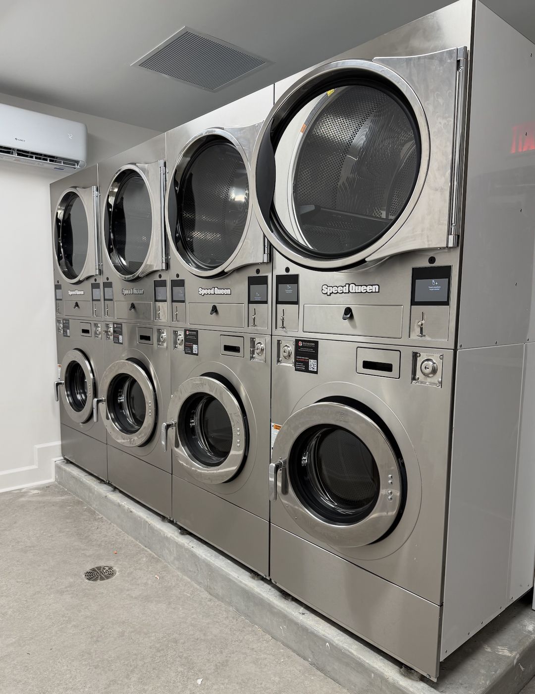 Stacked Speed Queen washers and dryers