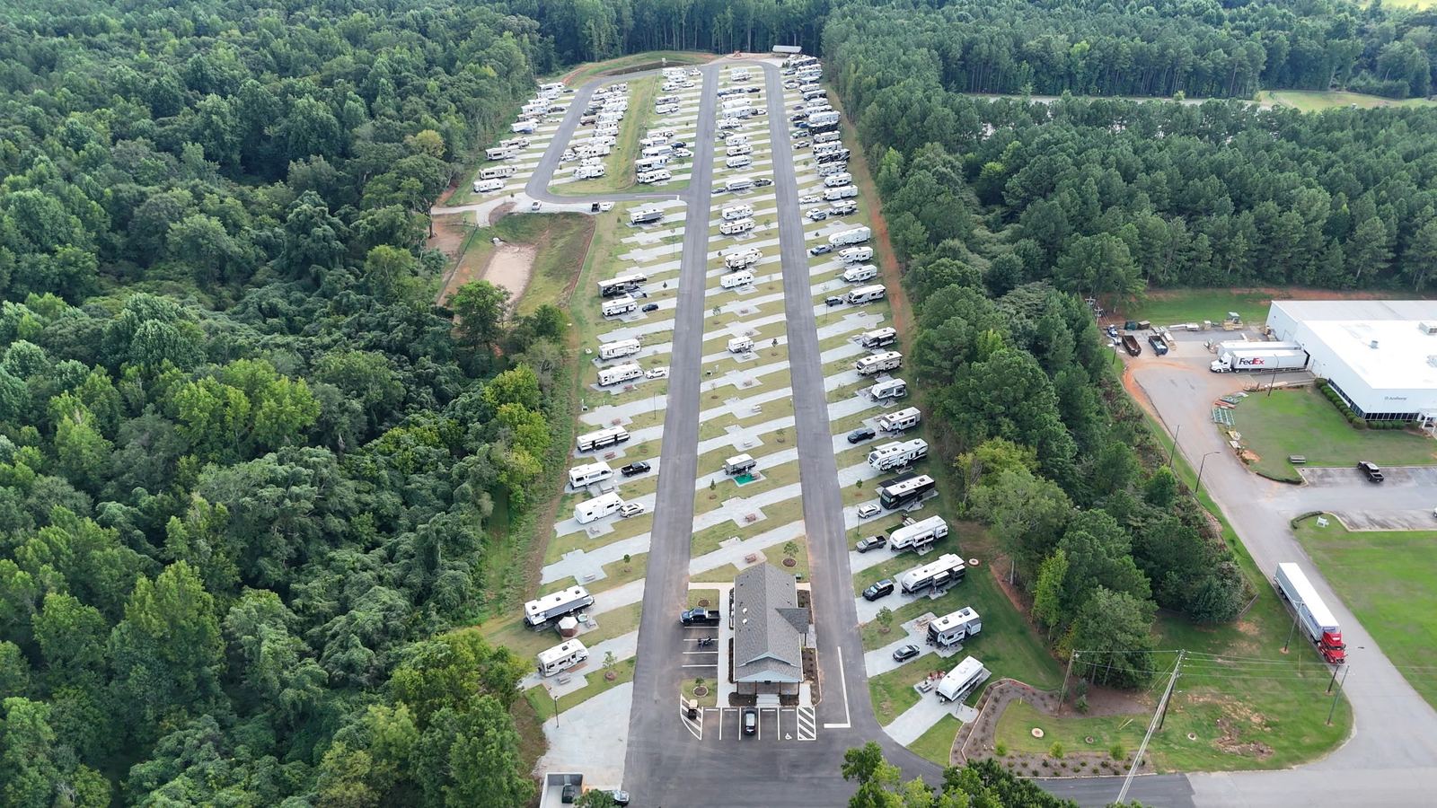 Rows of full-hookup sites with the bath house in front