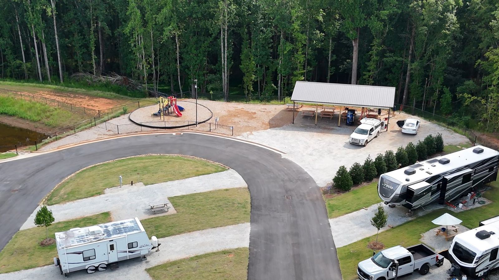 Playground and covered picnic pavilion beside the pond